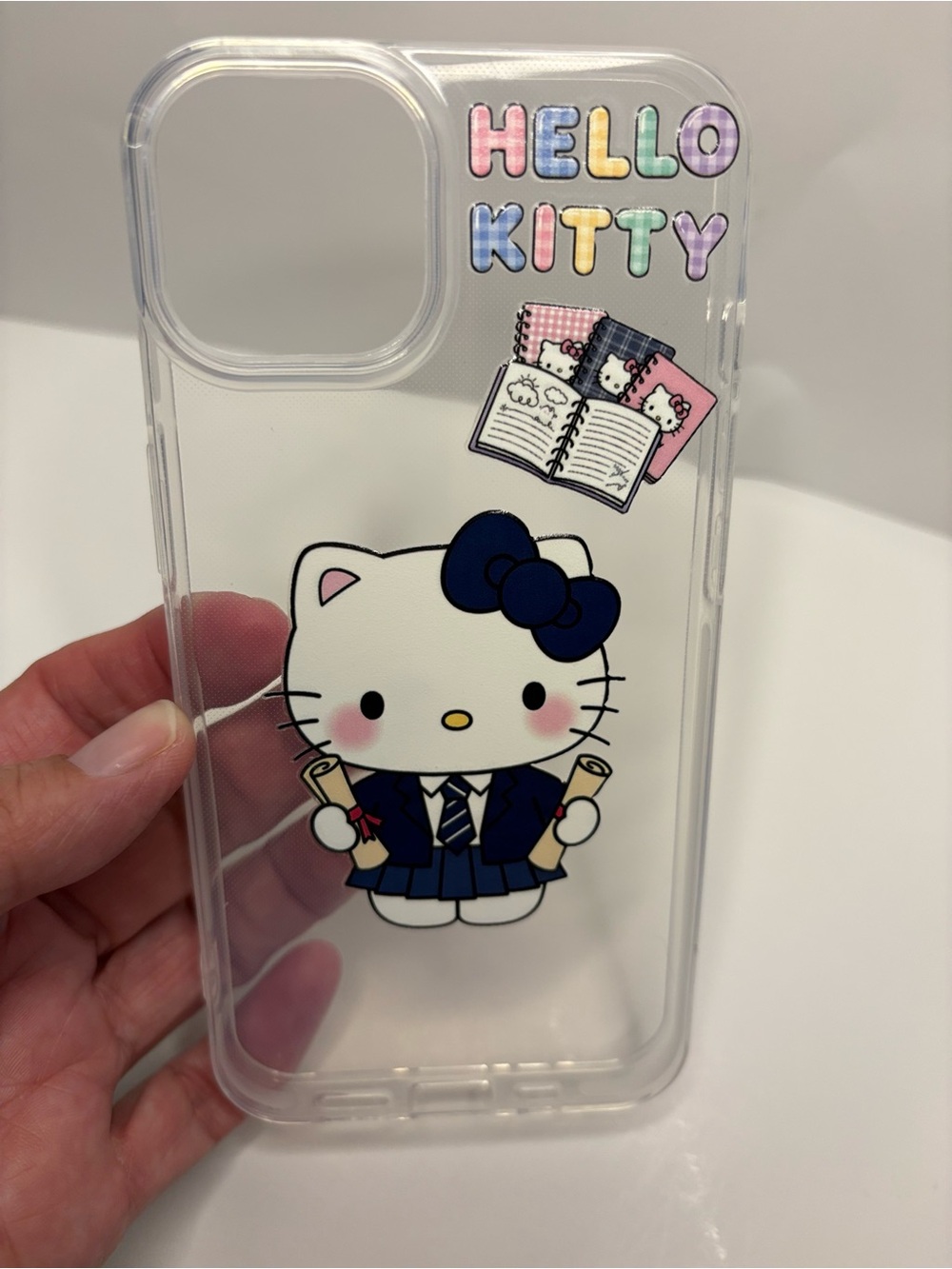 iPhone 14 Hello Kitty Clear Phone Case with Navy Bow and Pastel Lettering